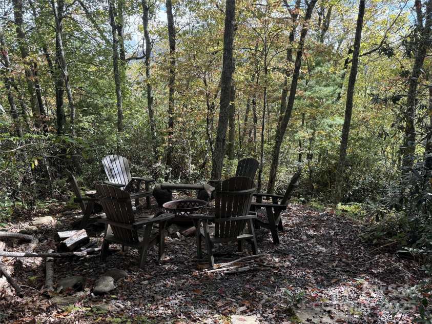 94 Davey Crockett Road, Fairview, NC 28730.  MLS# CAR4310188, YatesRealty ID 11377. Fire Pit in the woods