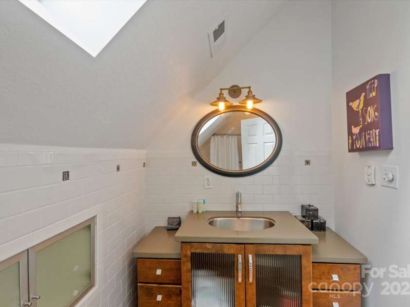 94 Davey Crockett Road, Fairview, NC 28730.  MLS# CAR4310188, YatesRealty ID 11377. Hall Bathroom