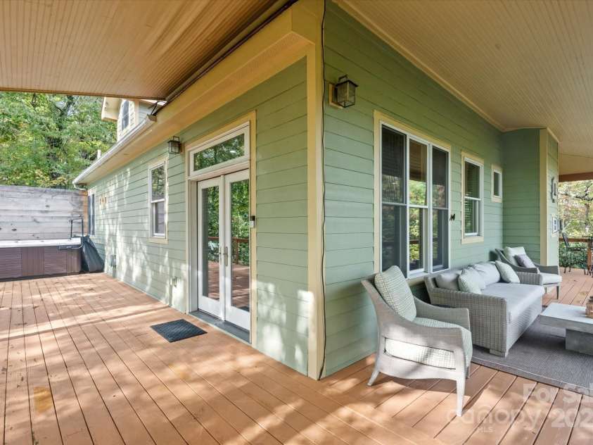94 Davey Crockett Road, Fairview, NC 28730.  MLS# CAR4310188, YatesRealty ID 11377. Wraparound Porch with Hot Tub