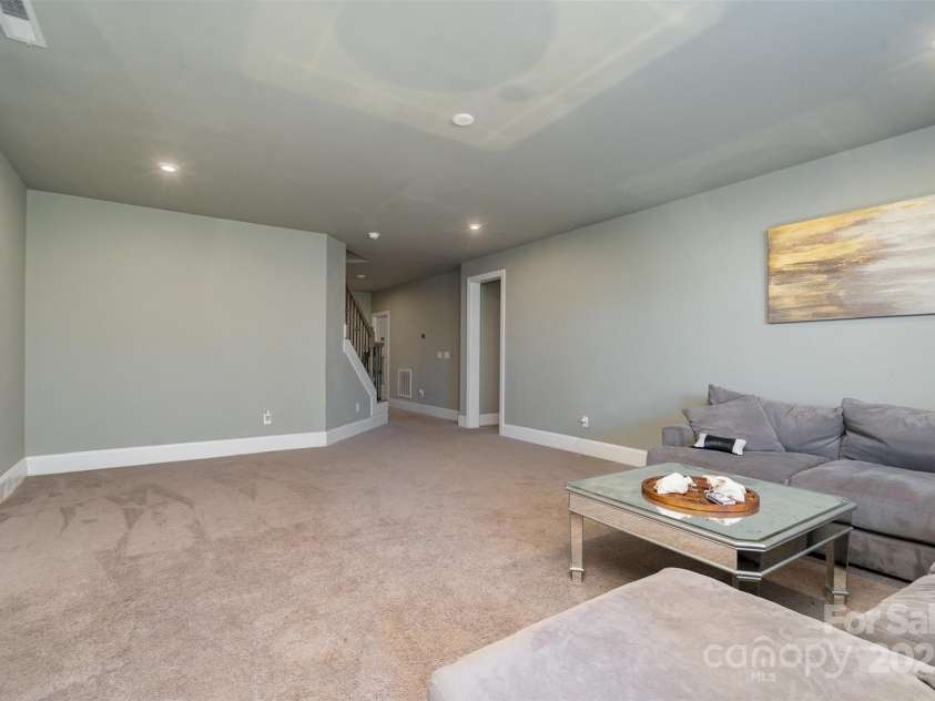 14018 Promenade Drive, Huntersville, NC 28078.  MLS# CAR4216690, YatesRealty ID 11390. Basement living room