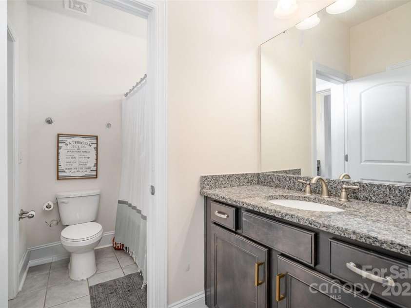 14018 Promenade Drive, Huntersville, NC 28078.  MLS# CAR4216690, YatesRealty ID 11390. Main level en suite/passthrough bathroom