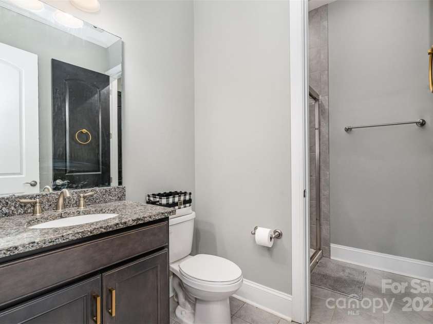 14018 Promenade Drive, Huntersville, NC 28078.  MLS# CAR4216690, YatesRealty ID 11390. Passthrough bathroom