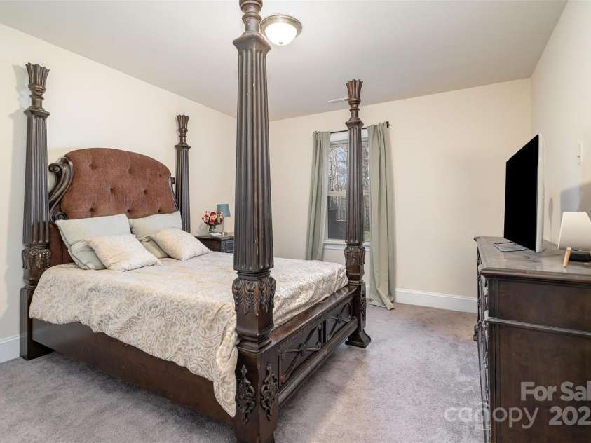 14018 Promenade Drive, Huntersville, NC 28078.  MLS# CAR4216690, YatesRealty ID 11390. Walkout basement bedroom with en suite