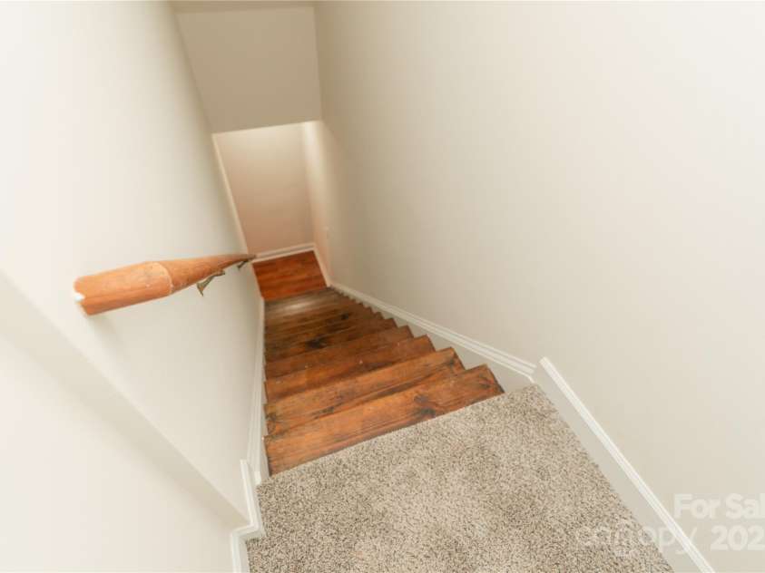 4410 Laurel Twig Court, Charlotte, NC 28215.  MLS# CAR4251605, YatesRealty ID 11395. Second starircase leading rom ktichen to upstair bonus room