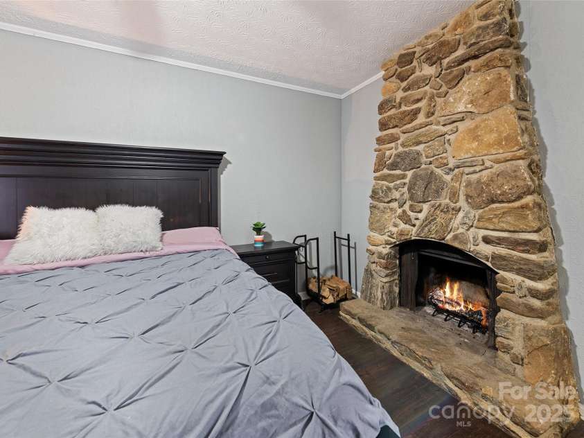 144 Pinehaven Drive, Clyde, NC 28721.  MLS# CAR4242405, YatesRealty ID 11396.  Large, primary bd rm , . Ground floor FIRE PLACE
