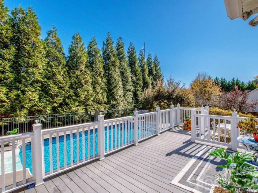 2344 Smith Cove Road, Denver, NC 28037.  MLS# CAR4321510, YatesRealty ID 11399. In-ground pool with oversized deck 