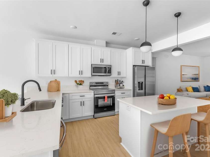 5209 Carden Drive, Charlotte, NC 28227.  MLS# CAR4250481, YatesRealty ID 11412. Virtual Staging - Kitchen / Living room