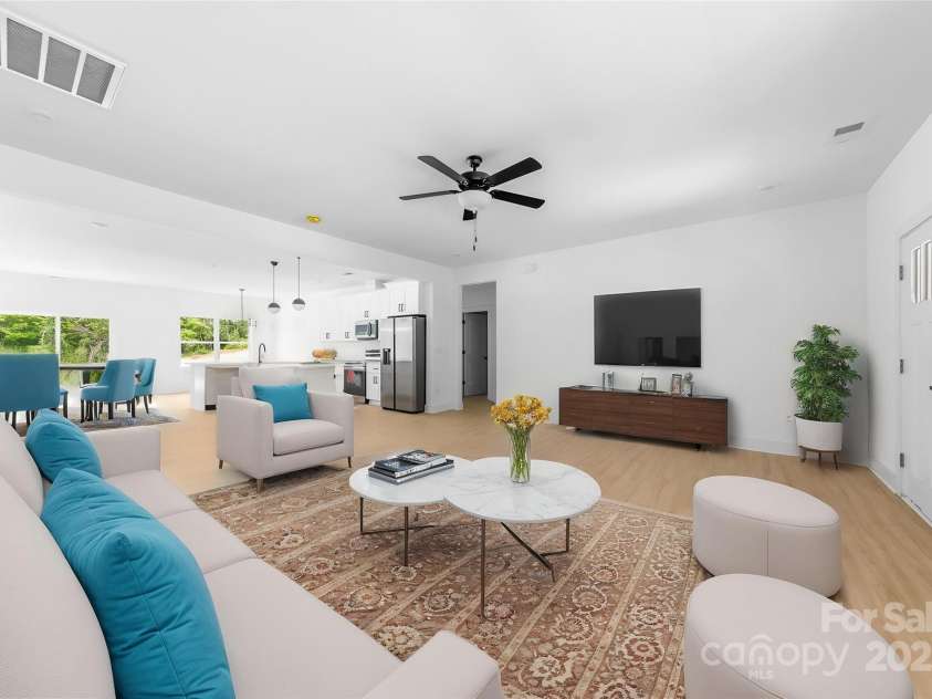 5209 Carden Drive, Charlotte, NC 28227.  MLS# CAR4250481, YatesRealty ID 11412. Virtual Staging - Living room / Kitchen