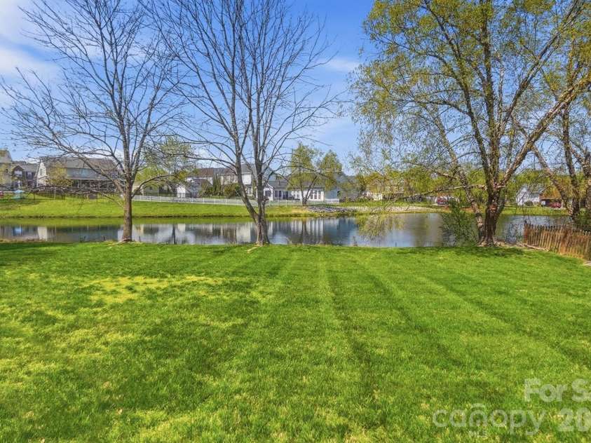 1009 Onotoa Drive, Indian Trail, NC 28079.  MLS# CAR4358436, YatesRealty ID 11417. Backyard Lawn