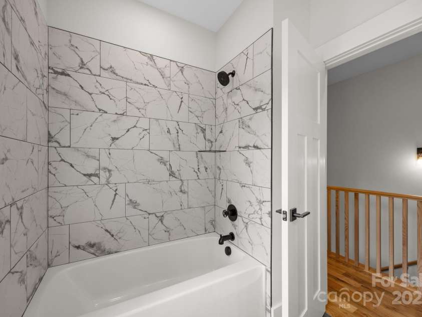 117 Third Street, Asheville, NC 28803.  MLS# CAR4293672, YatesRealty ID 11422. Large tub in hall bath