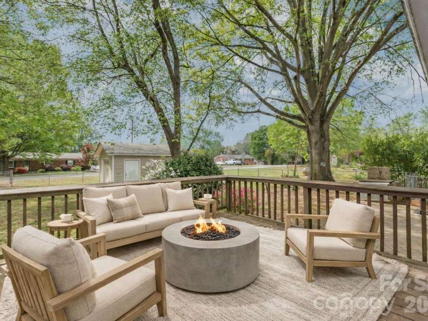 105 Sunset Drive, Locust, NC 28097.  MLS# CAR4368490, YatesRealty ID 11423. Large Deck Overlooking Fully Fenced Backyard - Virtually Staged