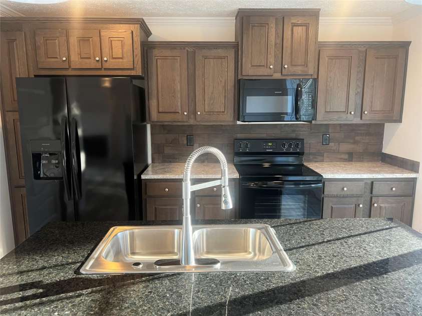 5748 Dalmatian Street, Iron Station, NC 28080.  MLS# CAR3927310, YatesRealty ID 1143. Kitchen