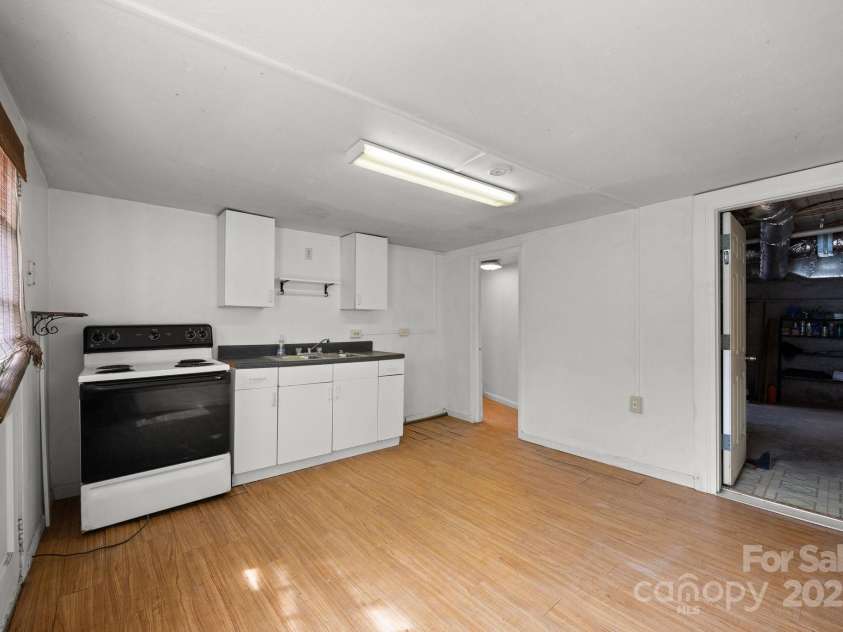 67 Montana Avenue, Asheville, NC 28806.  MLS# CAR4242878, YatesRealty ID 11433. Basement Kitchen