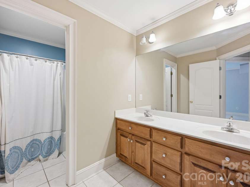 118 Broadbill Drive, Mooresville, NC 28117.  MLS# CAR4395594, YatesRealty ID 11435. Upper level full bath with dual vanity.