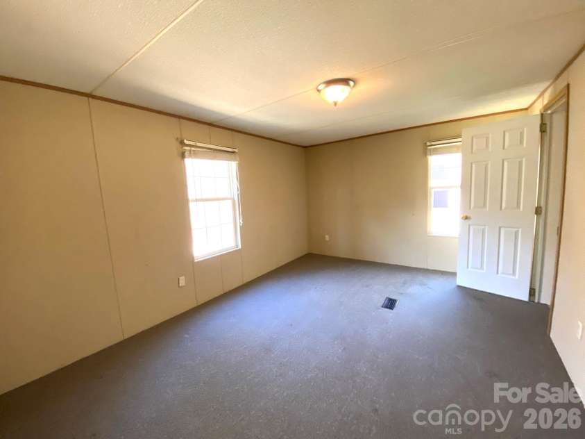 16 Molly Lane, Candler, NC 28715.  MLS# CAR4358310, YatesRealty ID 11445. 