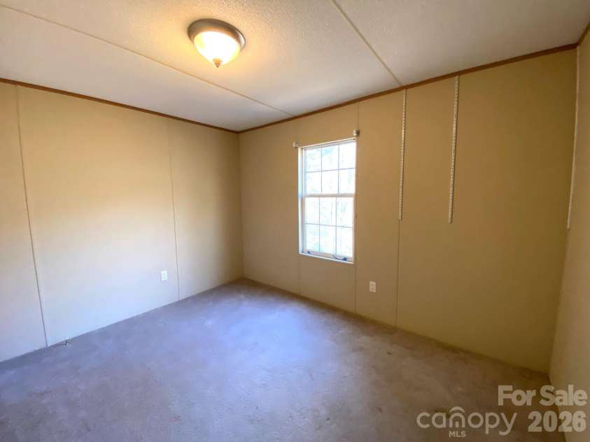 16 Molly Lane, Candler, NC 28715.  MLS# CAR4358310, YatesRealty ID 11445. 