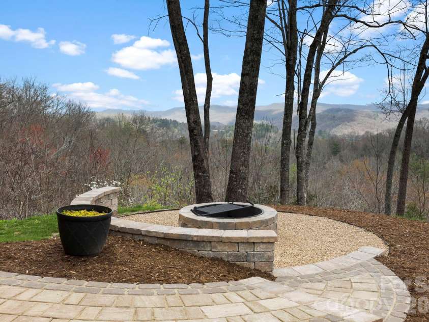 362 Gray Fox Road, Rosman, NC 28772.  MLS# CAR4366224, YatesRealty ID 11447. Beautifully finished firepit with brick pavers!
