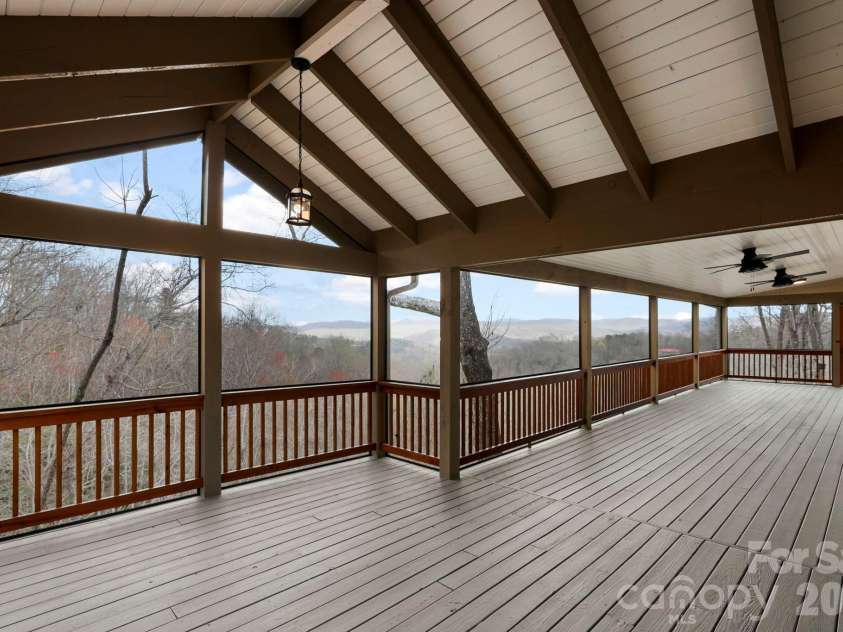 362 Gray Fox Road, Rosman, NC 28772.  MLS# CAR4366224, YatesRealty ID 11447. Take in these long range mountain views from this expansive screened in back deck!