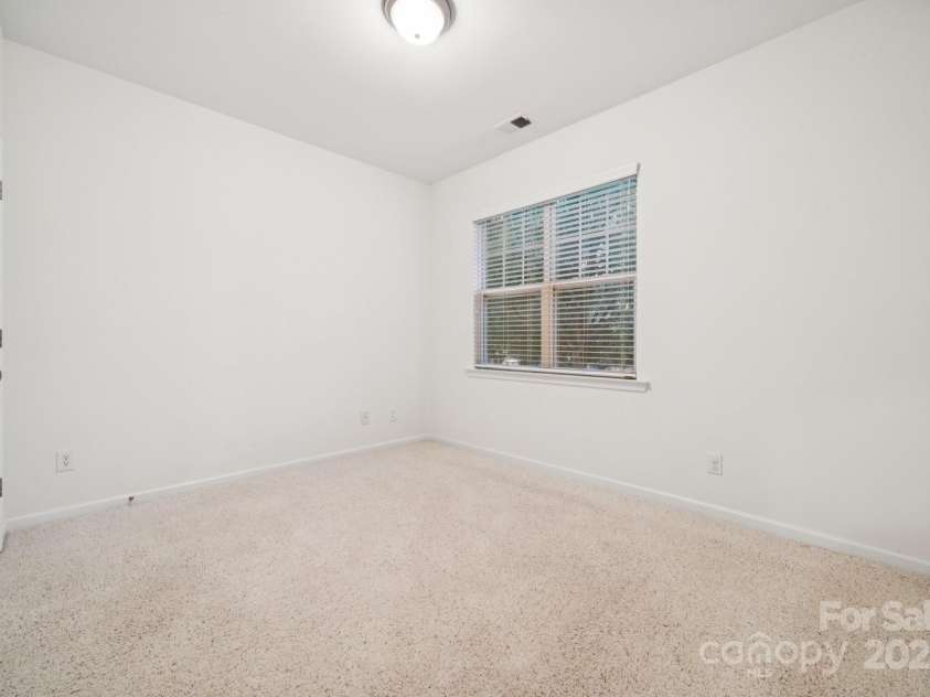 8408 Brookings Drive, Charlotte, NC 28269.  MLS# CAR4284673, YatesRealty ID 1145. 2nd bedroom has enough room for a guest or fitness room