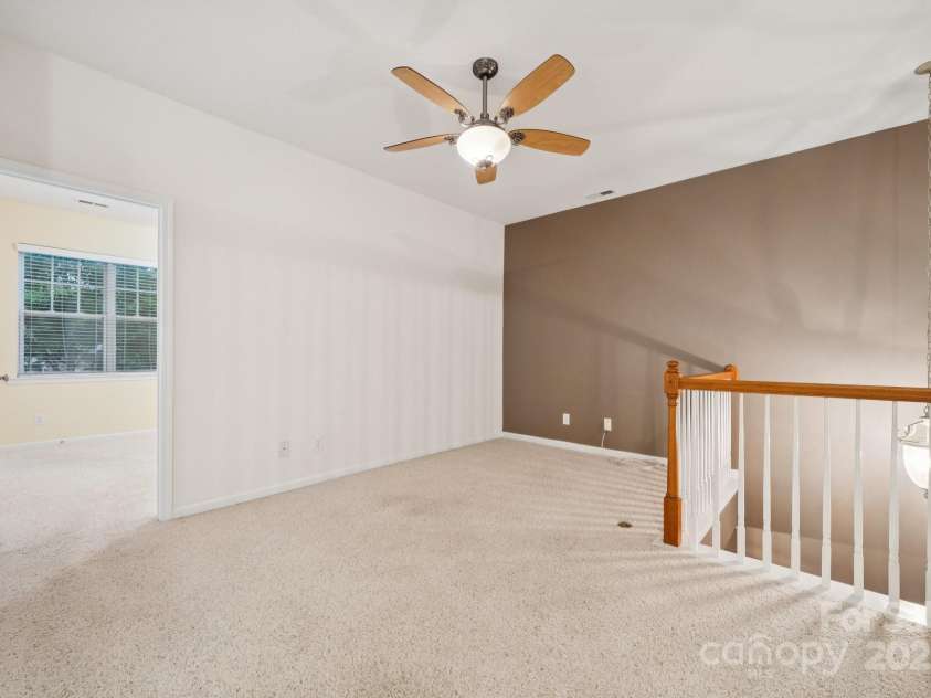 8408 Brookings Drive, Charlotte, NC 28269.  MLS# CAR4284673, YatesRealty ID 1145. Hang out in the loft area with company.