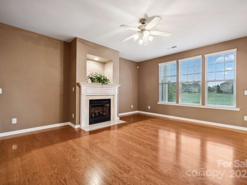 8408 Brookings Drive, Charlotte, NC 28269.  MLS# CAR4284673, YatesRealty ID 1145. Natural light pours into the living area with a gas log!