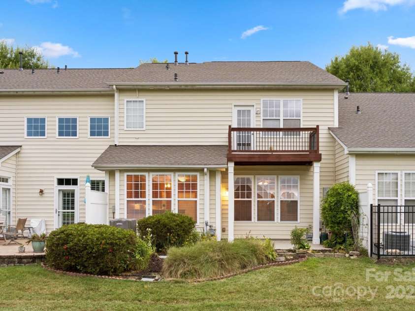 8408 Brookings Drive, Charlotte, NC 28269.  MLS# CAR4284673, YatesRealty ID 1145. Relax on the back patio with a morning coffee or watch the golfers!