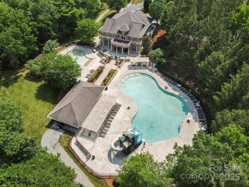 8408 Brookings Drive, Charlotte, NC 28269.  MLS# CAR4284673, YatesRealty ID 1145. Sports Club has a park and pool for all ages! Our pool has two slides and another section for the younger people. There is a basketball court and disc golf.