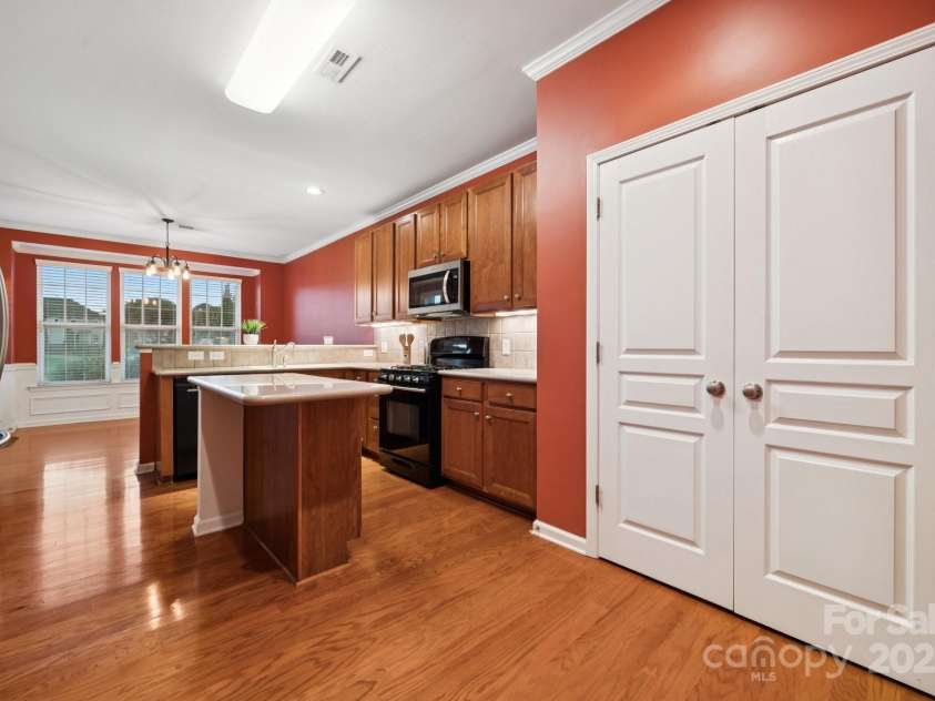 8408 Brookings Drive, Charlotte, NC 28269.  MLS# CAR4284673, YatesRealty ID 1145. The center island is great for food prepping with enough pantry space.