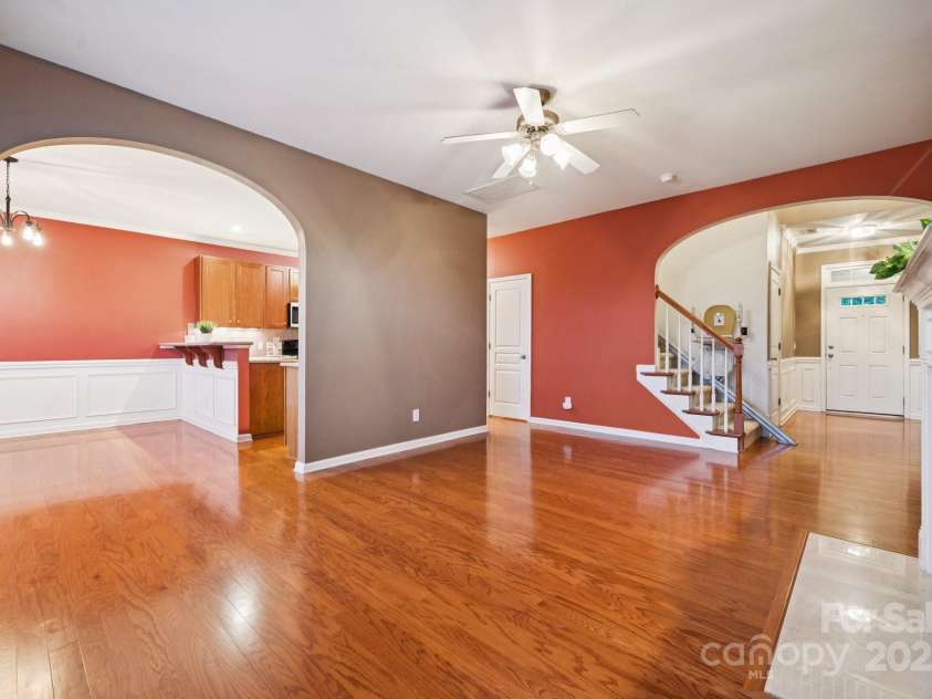 8408 Brookings Drive, Charlotte, NC 28269.  MLS# CAR4284673, YatesRealty ID 1145. The layout of the living area, kitchen, front hallyway and the stair lift on the stairs!