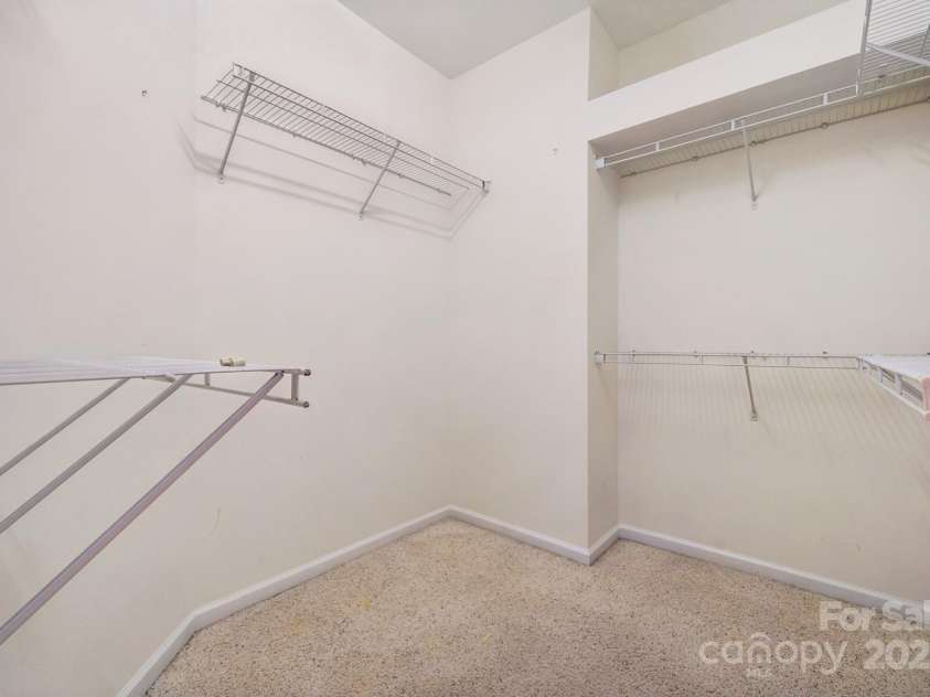 8408 Brookings Drive, Charlotte, NC 28269.  MLS# CAR4284673, YatesRealty ID 1145. The primary bedroom's walk in closet has enough space for two!