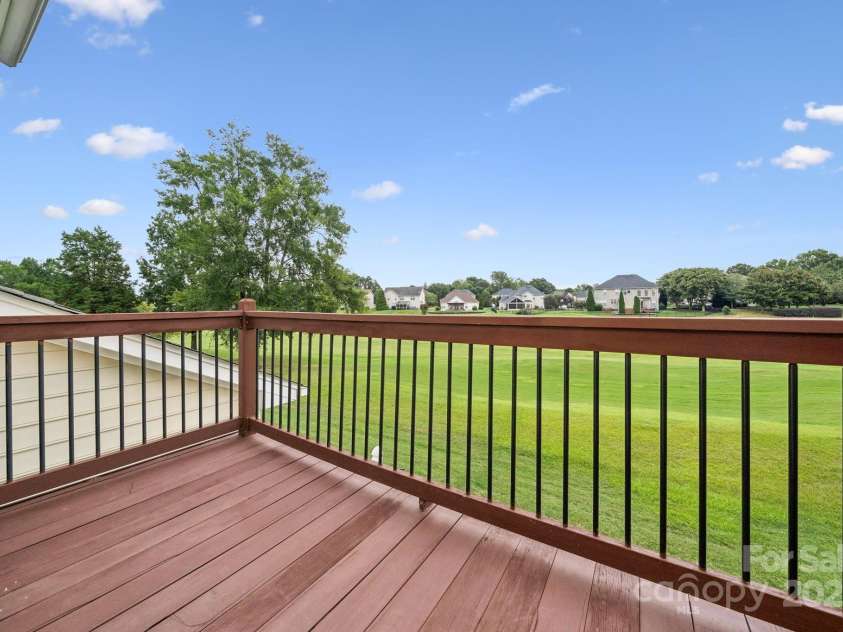 8408 Brookings Drive, Charlotte, NC 28269.  MLS# CAR4284673, YatesRealty ID 1145. Unwind with a sip of coffee and watch the golfers on hole 14th!