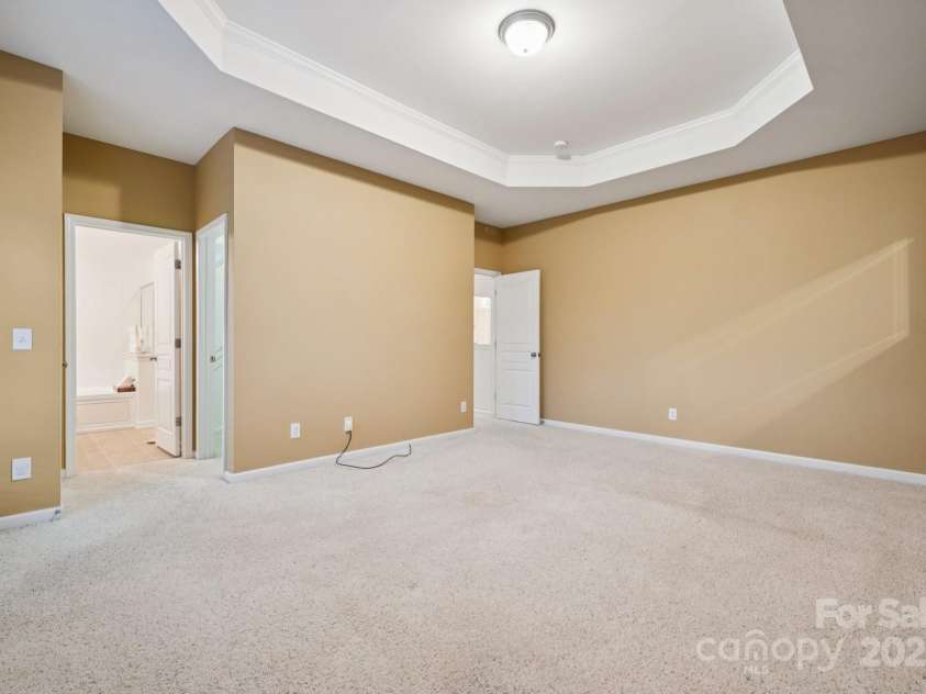 8408 Brookings Drive, Charlotte, NC 28269.  MLS# CAR4284673, YatesRealty ID 1145. What a spacious primary bedroom with room for a California King bed!