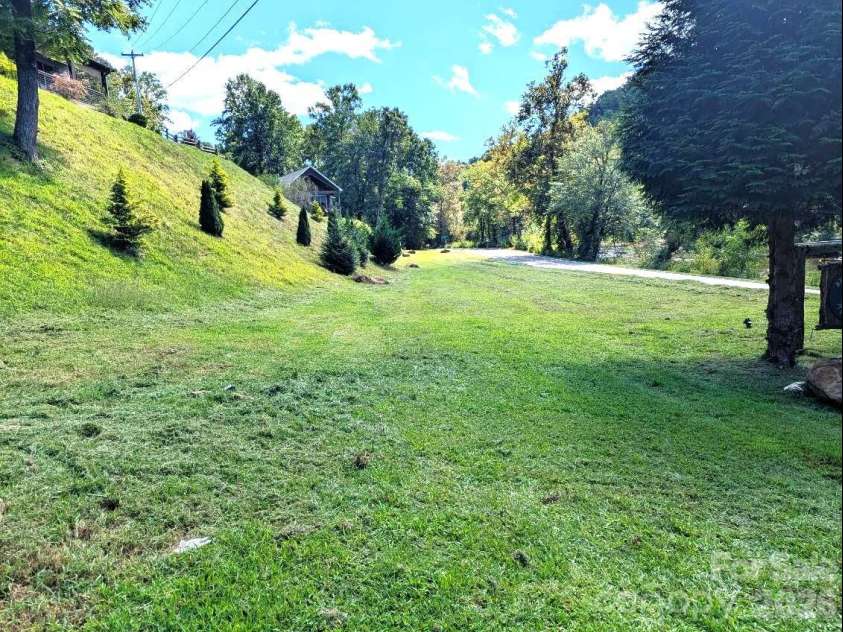 10 Rio Bravo Drive, Sylva, NC 28779.  MLS# CAR4296478, YatesRealty ID 1146. Approximate half the field