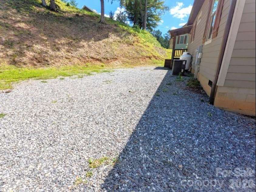 10 Rio Bravo Drive, Sylva, NC 28779.  MLS# CAR4296478, YatesRealty ID 1146. More parking in back