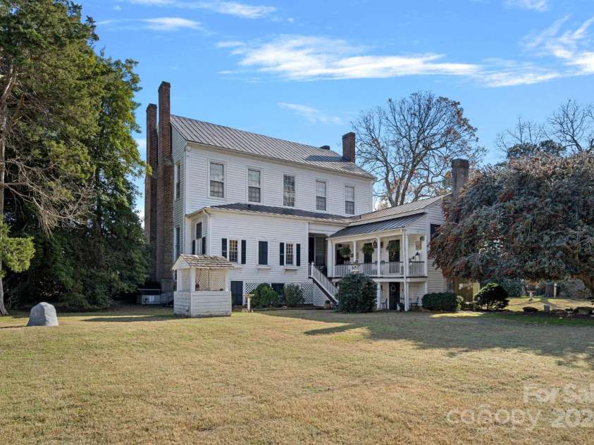 104 Leslie Loop, Mooresville, NC 28115.  MLS# CAR4195674, YatesRealty ID 11464. Rear view of plantation home