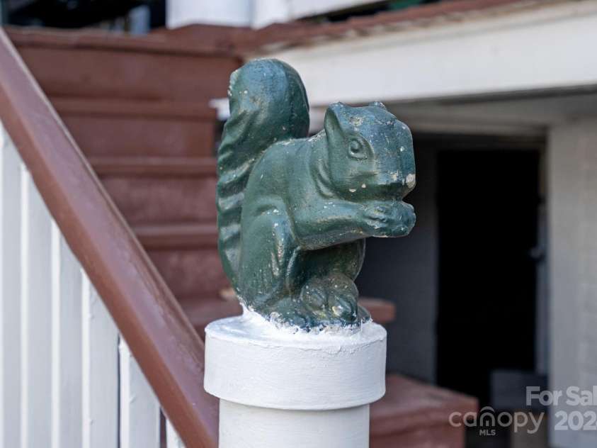 104 Leslie Loop, Mooresville, NC 28115.  MLS# CAR4195674, YatesRealty ID 11464. Squirrel friend finial on the back porch steps