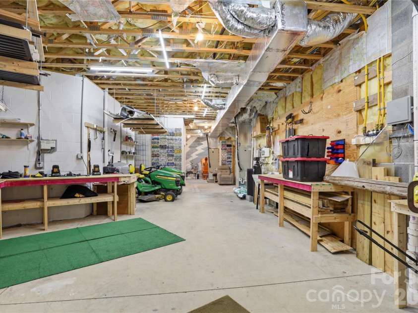 1084 Rocky Headwaters Road, Moravian Falls, NC 28654.  MLS# CAR4360942, YatesRealty ID 11468. Basement Workshop