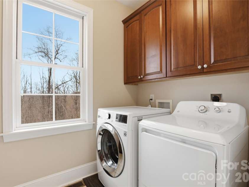1084 Rocky Headwaters Road, Moravian Falls, NC 28654.  MLS# CAR4360942, YatesRealty ID 11468. Main Level Laundry