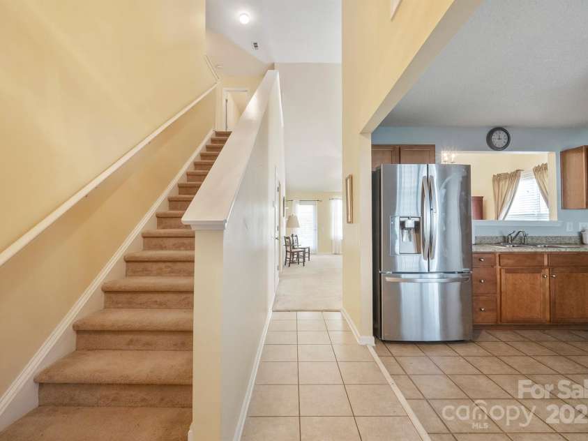 1219 Catawba Run Road, Lowell, NC 28098.  MLS# CAR4235469, YatesRealty ID 11469. Front door entrance- stairs to other 2 bedrooms and loft area