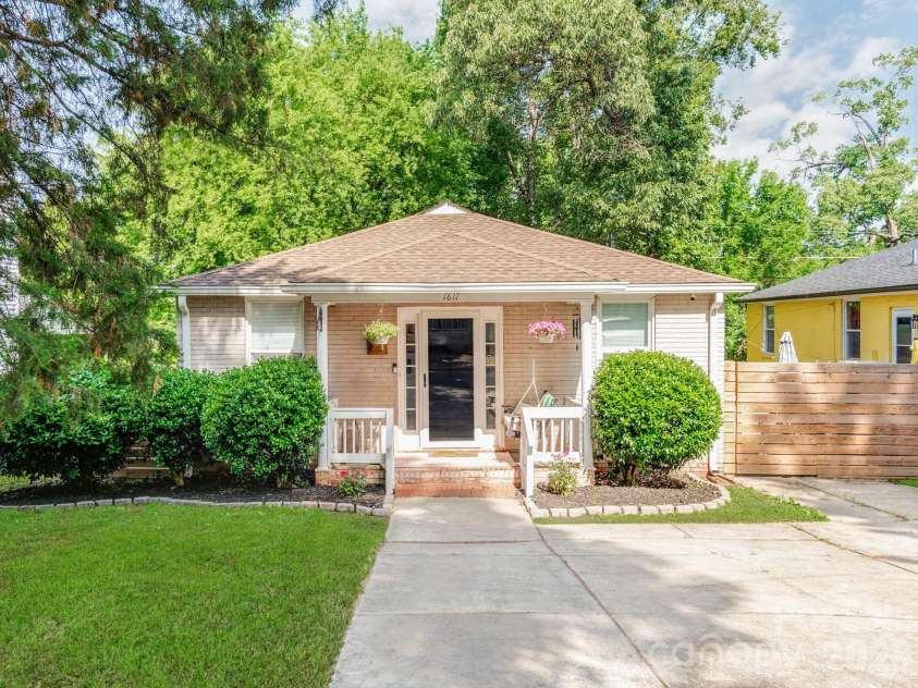 1817 Rush Wind Drive, Charlotte, NC 28206.  MLS# CAR4354080, YatesRealty ID 11474. Front exterior with porch swing
