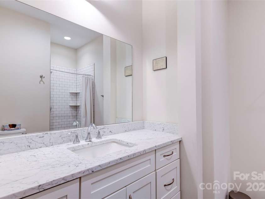 12 Waverly Road, Asheville, NC 28803.  MLS# CAR4256160, YatesRealty ID 11477. Second full bath with marble, penny tile walk -in shower