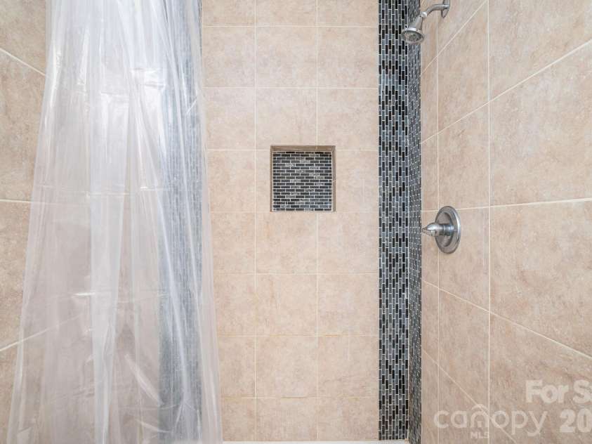 4804 Cedar Court, Gastonia, NC 28056.  MLS# CAR4356344, YatesRealty ID 11483. Gorgeous tiled shower.
