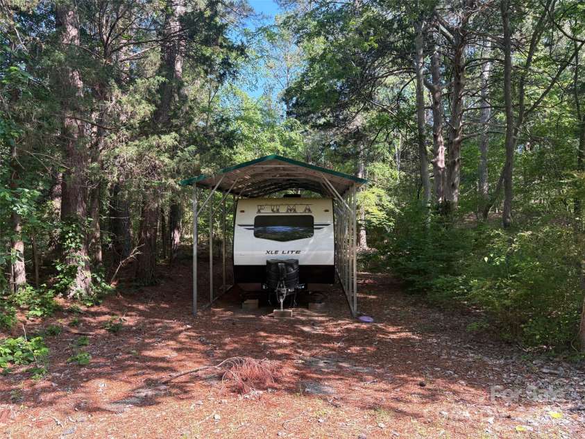1355 Woodrun Court, Rock Hill, SC 29732.  MLS# CAR4256126, YatesRealty ID 11497. RV Carport lower driveway on lefthand side.