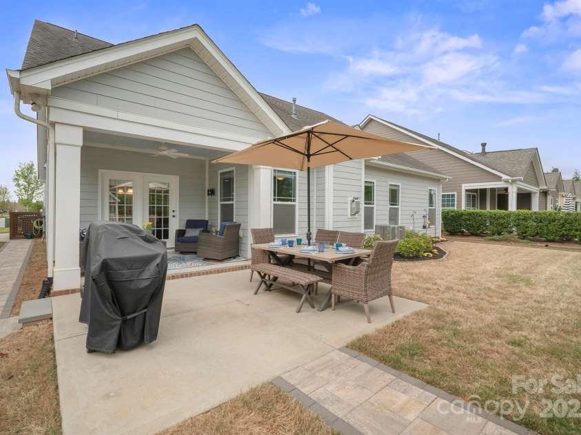 13115 Union Square Drive, Huntersville, NC 28078.  MLS# CAR4247415, YatesRealty ID 11499. Back covered porch and extended patio and the side brick paver walkway