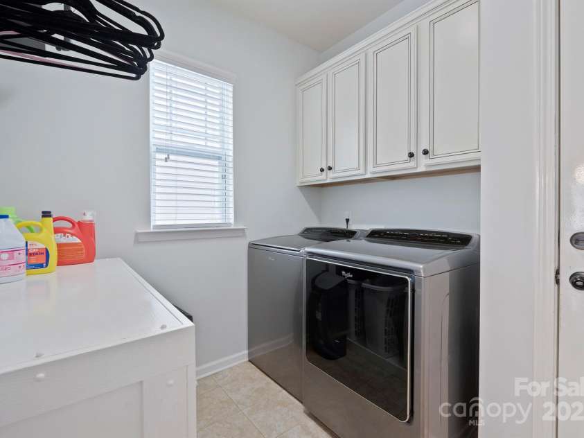 13115 Union Square Drive, Huntersville, NC 28078.  MLS# CAR4247415, YatesRealty ID 11499. Laundry room has a great folding table that will stay and the washer and dryer remain