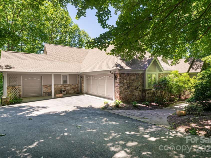 57 Old Hickory Trail, Hendersonville, NC 28739.  MLS# CAR4150896, YatesRealty ID 115. Ample 2 car garage with additional golf cart garage