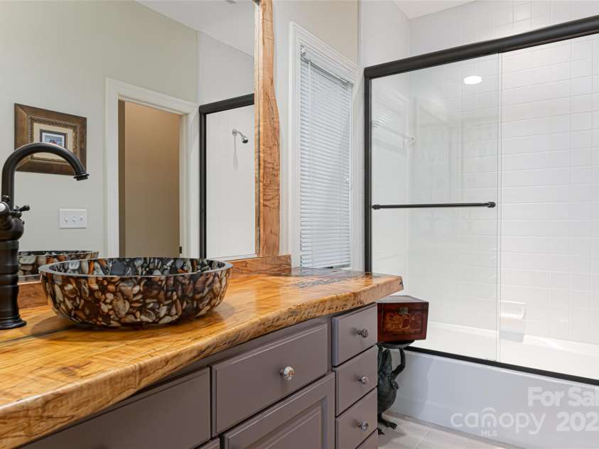 57 Old Hickory Trail, Hendersonville, NC 28739.  MLS# CAR4150896, YatesRealty ID 115. En-suite bathroom on the main level