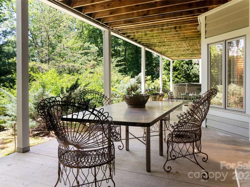 57 Old Hickory Trail, Hendersonville, NC 28739.  MLS# CAR4150896, YatesRealty ID 115. Terrace level patio includes hot tub
