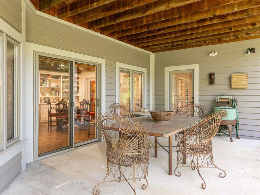 57 Old Hickory Trail, Hendersonville, NC 28739.  MLS# CAR4150896, YatesRealty ID 115. Terrace level patio includes hot tub