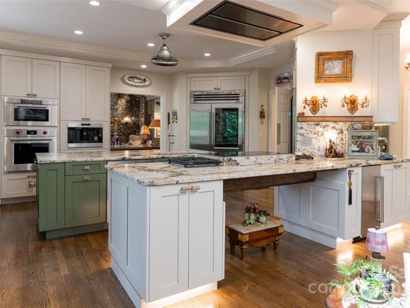 57 Old Hickory Trail, Hendersonville, NC 28739.  MLS# CAR4150896, YatesRealty ID 115. The kitchen flows seamlessly into the den for optimal entertaining space